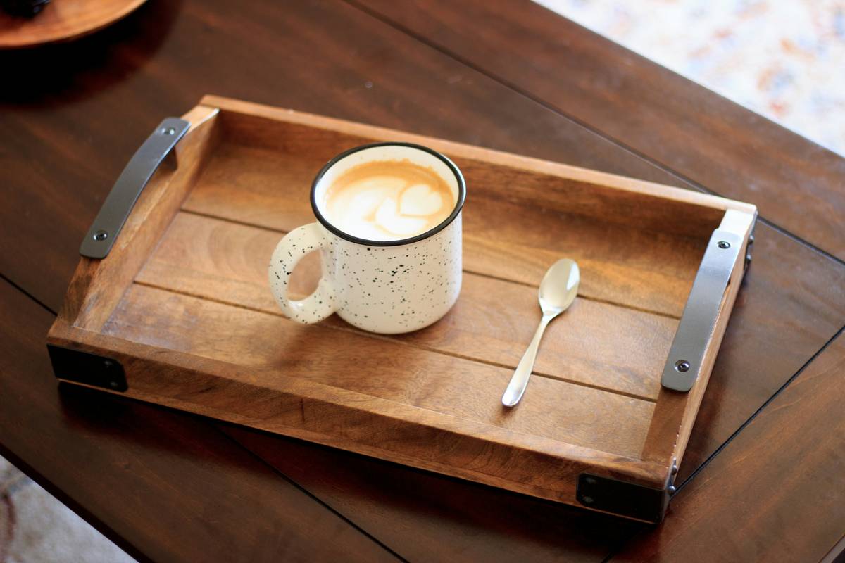 A rustic wooden serving tray styled with candles, succulents, and vintage books – wood serving trays home decor